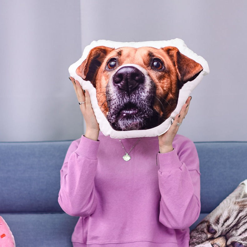 A pillow with a photo of a pet's face